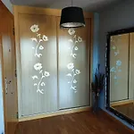 Acogedor En *